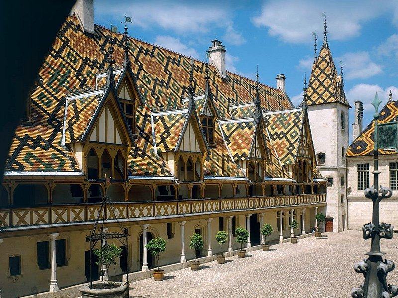 The Hôtel-Dieu courtyard in Beaune under its roofs of glazed polychrome tiles